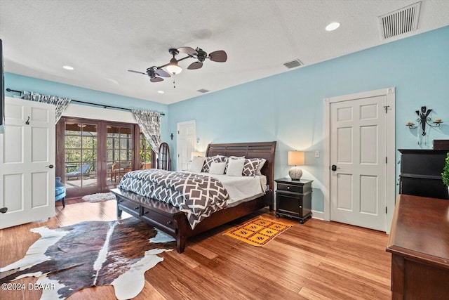 bedroom with ceiling fan, light hardwood / wood-style flooring, and access to outside