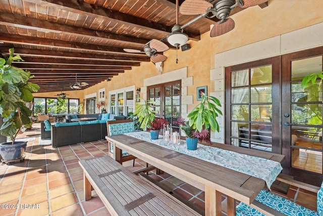 view of patio / terrace featuring ceiling fan, french doors, and an outdoor living space