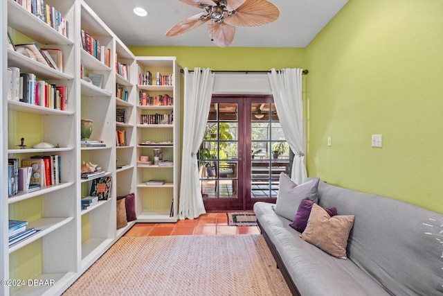 sitting room featuring light tile patterned flooring, ceiling fan, and french doors