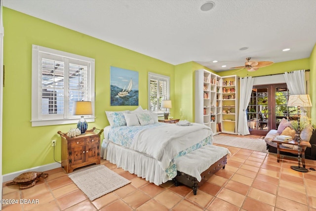 tiled bedroom featuring ceiling fan, a textured ceiling, and access to outside