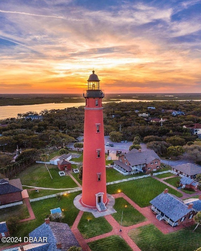 aerial view at dusk with a water view