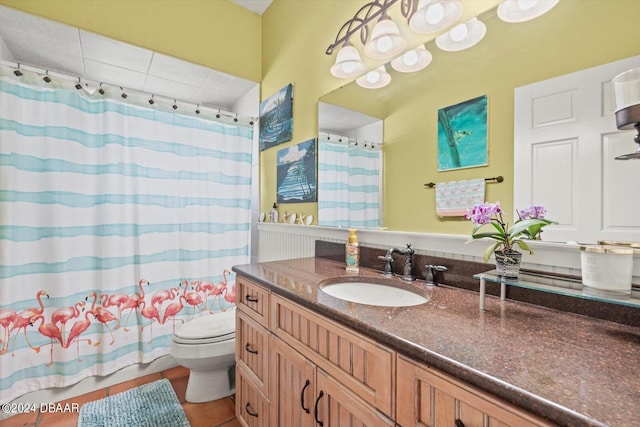 bathroom featuring vanity, tile patterned floors, toilet, and a shower with curtain