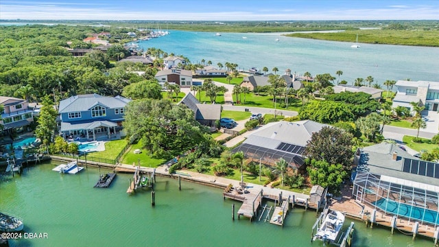 birds eye view of property with a water view