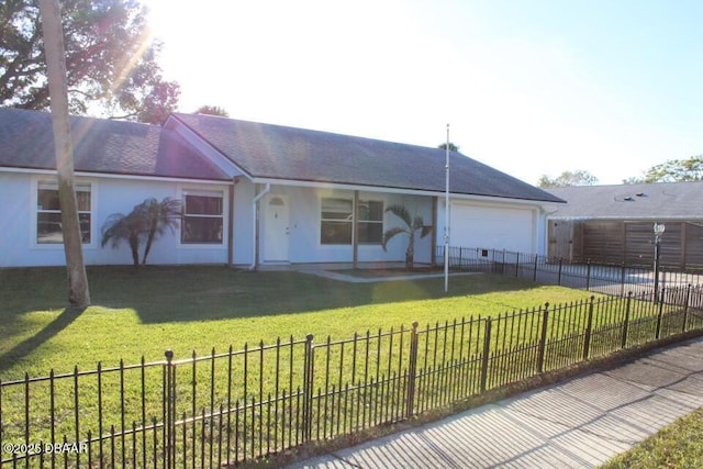 ranch-style house with a front yard and a garage