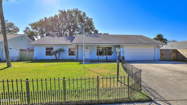 single story home with a front yard and a garage