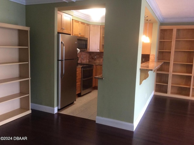 kitchen featuring light brown cabinets, crown molding, light hardwood / wood-style flooring, and appliances with stainless steel finishes