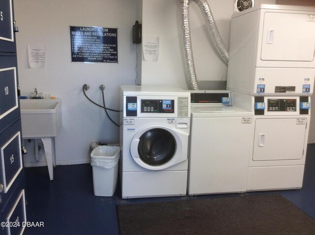 laundry room with stacked washer and dryer and independent washer and dryer