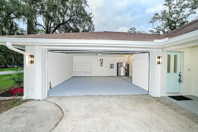 garage with stainless steel fridge