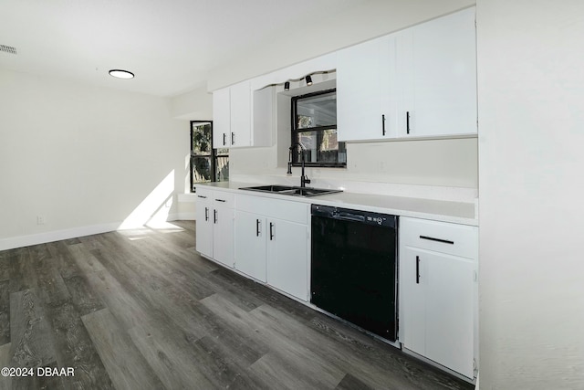 kitchen featuring sink, dark wood-type flooring, white cabinets, and dishwasher