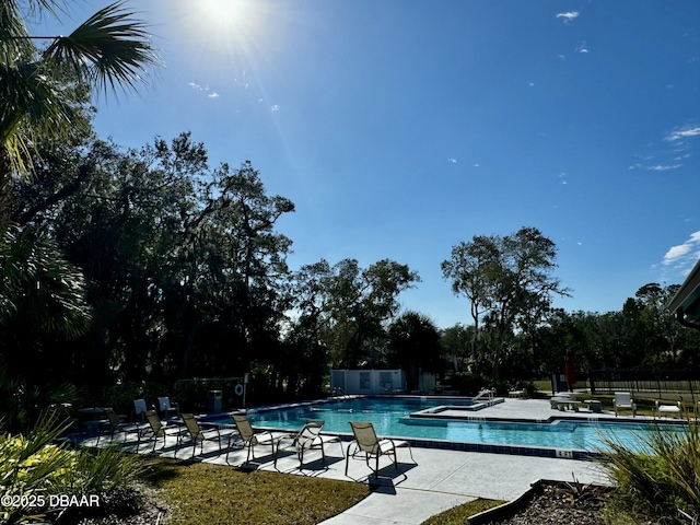 view of swimming pool with a patio