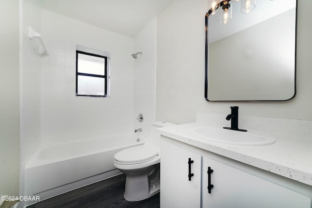 full bathroom featuring vanity, wood-type flooring, toilet, and washtub / shower combination