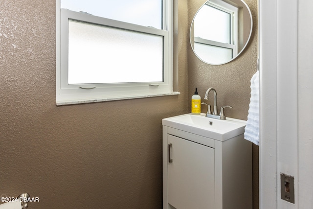 bathroom with vanity and a healthy amount of sunlight