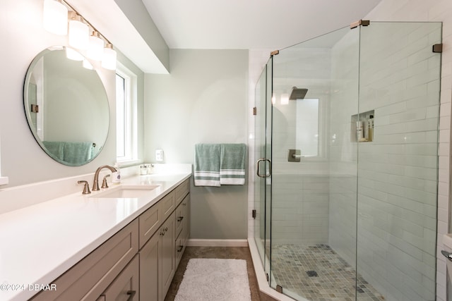 bathroom with vanity and walk in shower