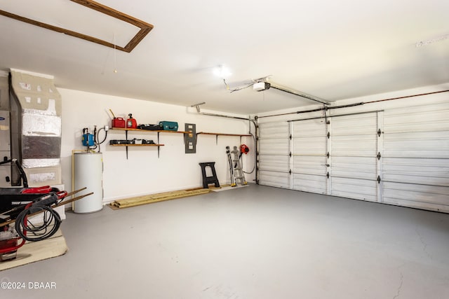 garage with water heater and a garage door opener