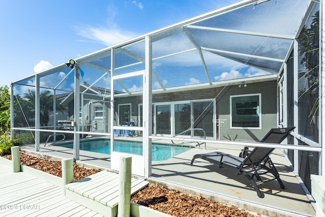 view of pool featuring a lanai