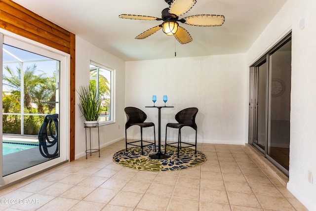 interior space featuring ceiling fan and light tile patterned floors