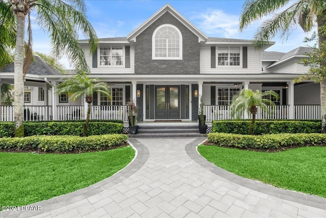 view of front of house with a front lawn and covered porch