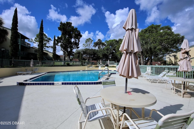 view of swimming pool with a patio area