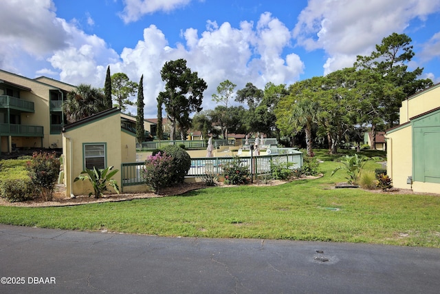 exterior space with a fenced in pool