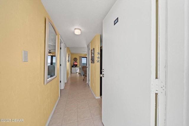3100 Ocean Shore Blvd Unit 5020, Ormond Beach, FL 32176 - corridor with light tile patterned flooring and baseboards