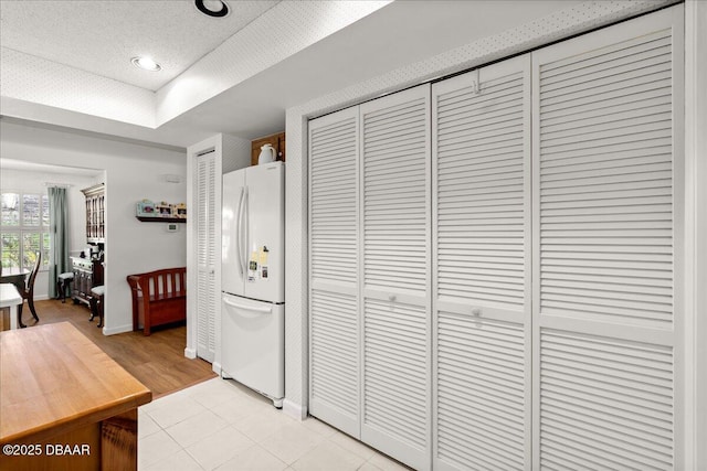 5 Southern Pine Trl, Ormond Beach, FL 32174 - kitchen featuring freestanding refrigerator and a textured ceiling