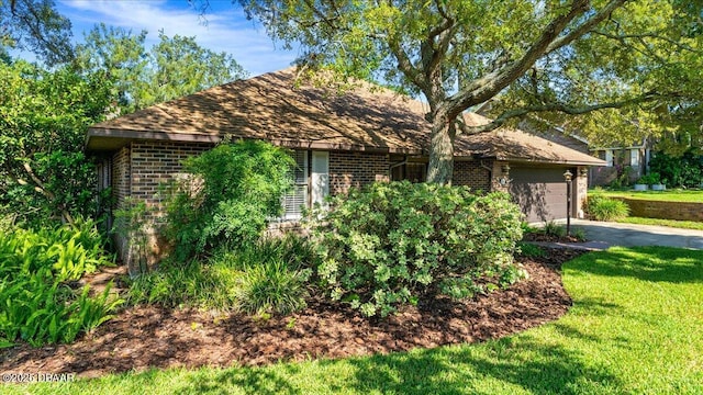 5 Southern Pine Trl, Ormond Beach, FL 32174 - view of property exterior featuring brick siding, driveway, an attached garage, and a lawn