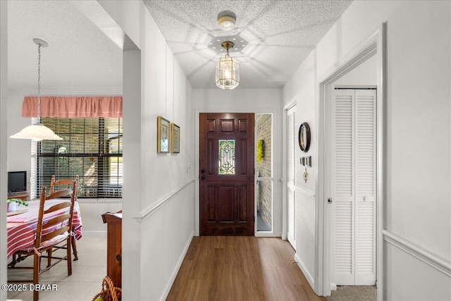 5 Southern Pine Trl, Ormond Beach, FL 32174 - entryway featuring baseboards and wood finished floors