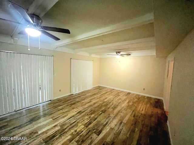 interior space featuring wood-type flooring and ceiling fan