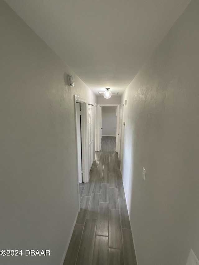 hallway featuring hardwood / wood-style floors