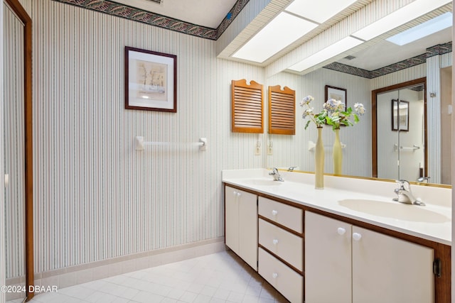 bathroom featuring tile patterned flooring and vanity