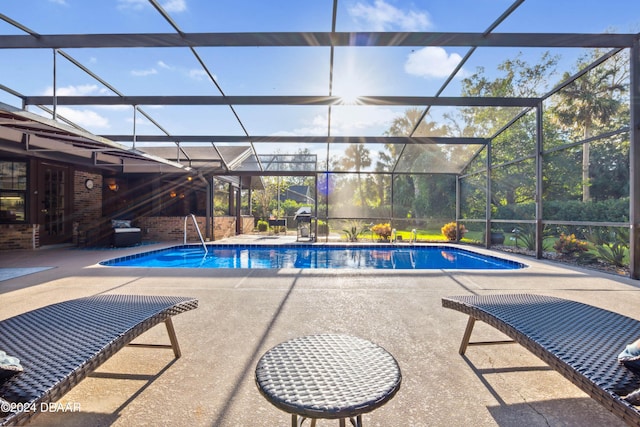 view of pool featuring a lanai and a patio area