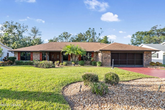 ranch-style house with a front lawn and a garage