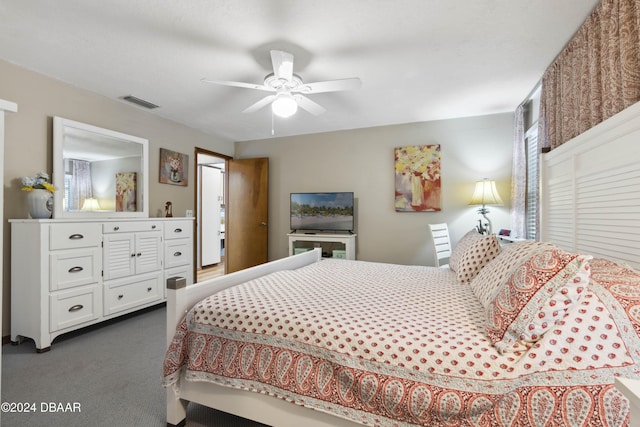 bedroom featuring ceiling fan and dark carpet