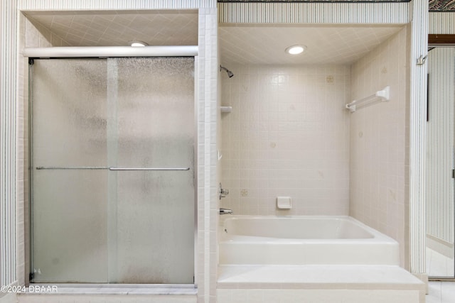 bathroom featuring plus walk in shower