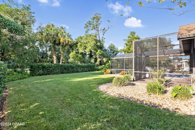 view of yard featuring glass enclosure