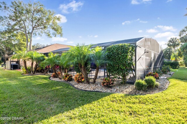 view of pool featuring glass enclosure and a patio area