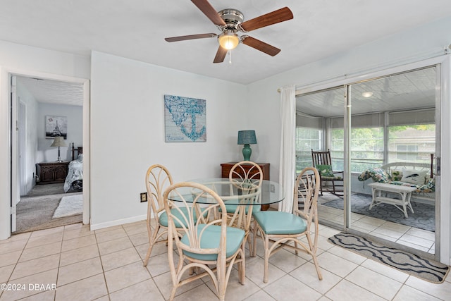 tiled dining room with ceiling fan