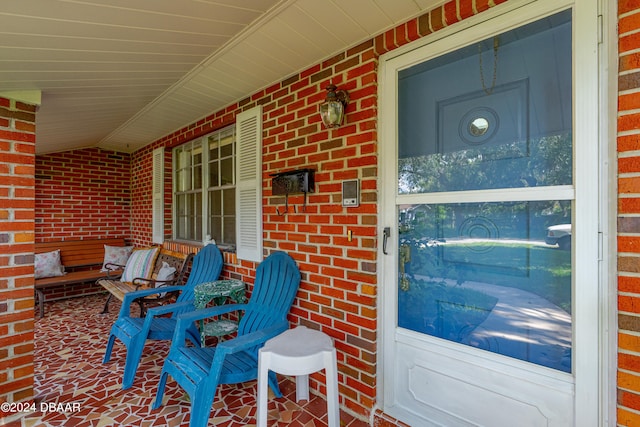 entrance to property featuring covered porch