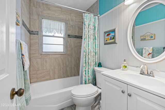 full bathroom featuring toilet, vanity, and shower / bathtub combination with curtain