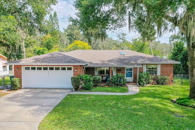 ranch-style home with a garage and a front lawn