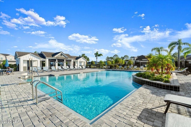 6341 Hanfield Dr, Port Orange, FL 32128 - community pool featuring a patio and a residential view