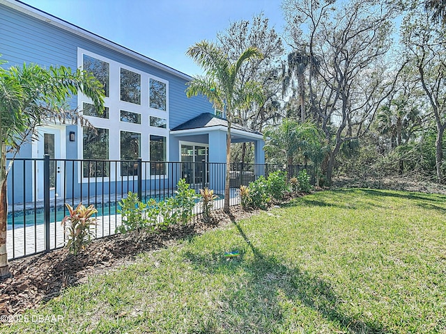 view of yard featuring a fenced in pool