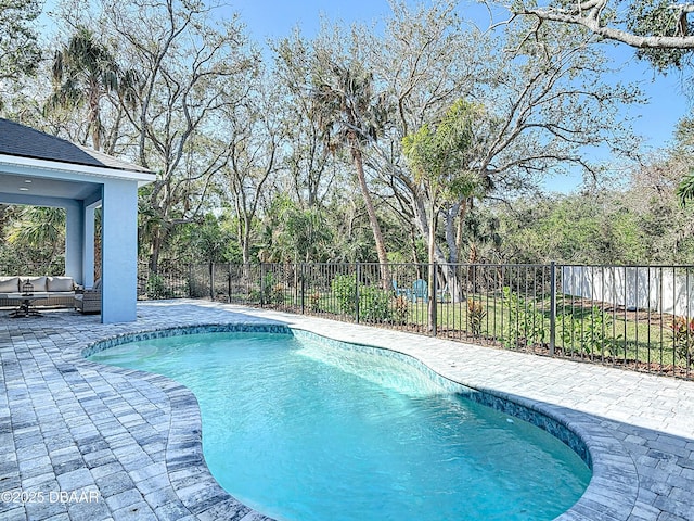 view of pool featuring outdoor lounge area and a patio area