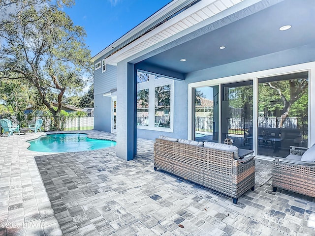 view of pool with a patio and outdoor lounge area