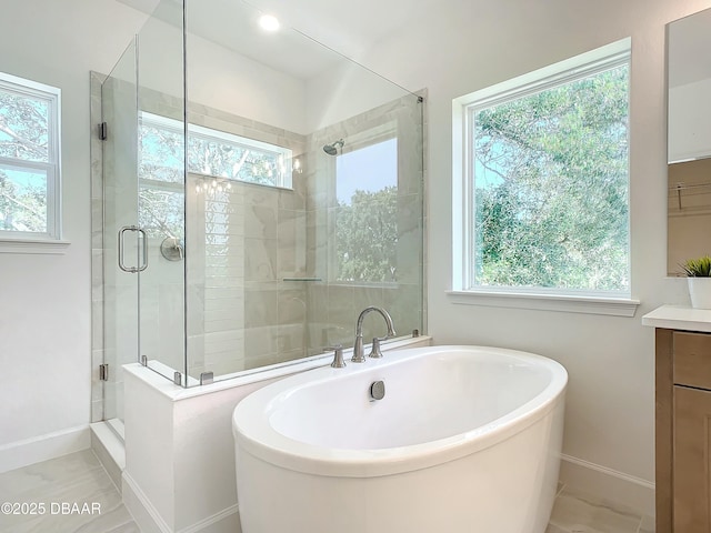 bathroom with shower with separate bathtub