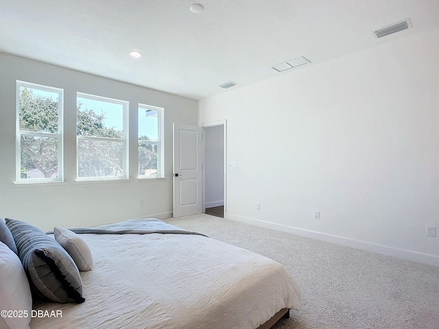 bedroom featuring light colored carpet