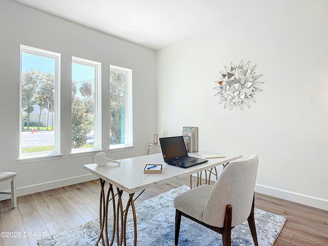 home office featuring hardwood / wood-style floors