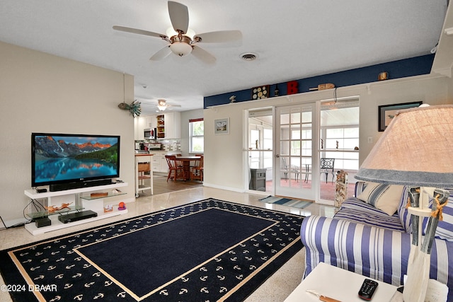 living room with ceiling fan