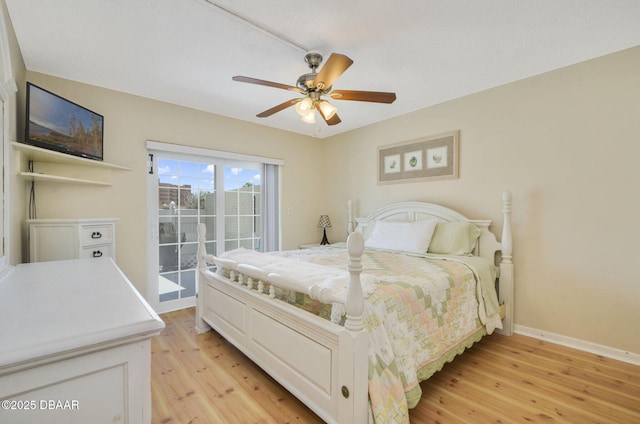 bedroom featuring access to outside, a ceiling fan, light wood-style flooring, and baseboards