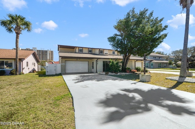 view of front of property with driveway, a gate, and a front lawn